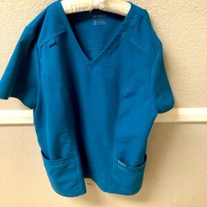 Women’s Jaanuu scrub Caribbean blue top with front pockets